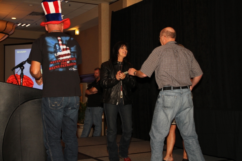 IMG_0548.JPG - Kenna handing out the prizes, and the winner giving it back to Ride For Joy. Every person who won did the exact same thing. 