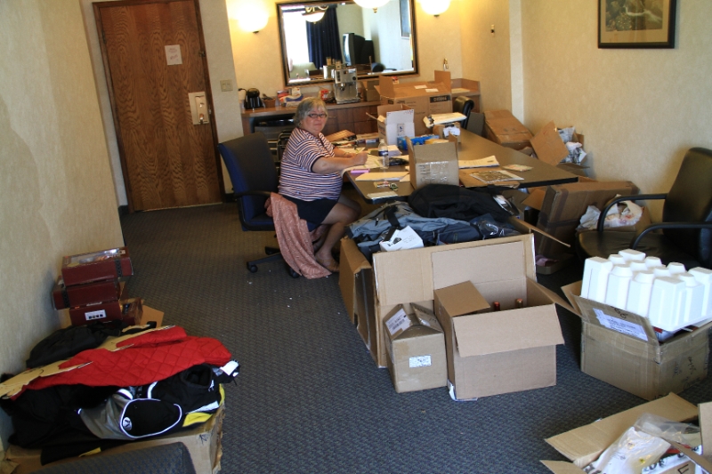 IMG_9561.JPG - Gilda helping get the silent auction organized