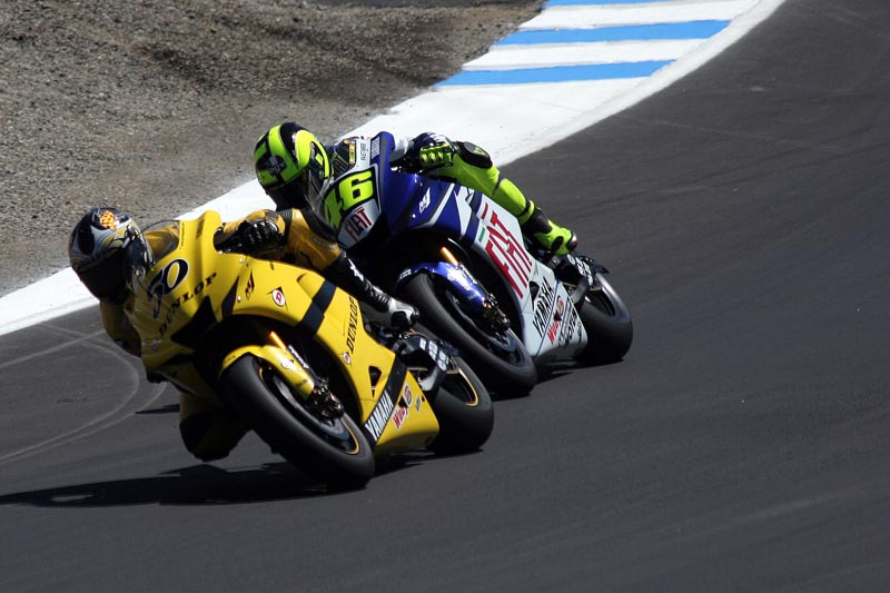 Guintoli being dogged by Rossi